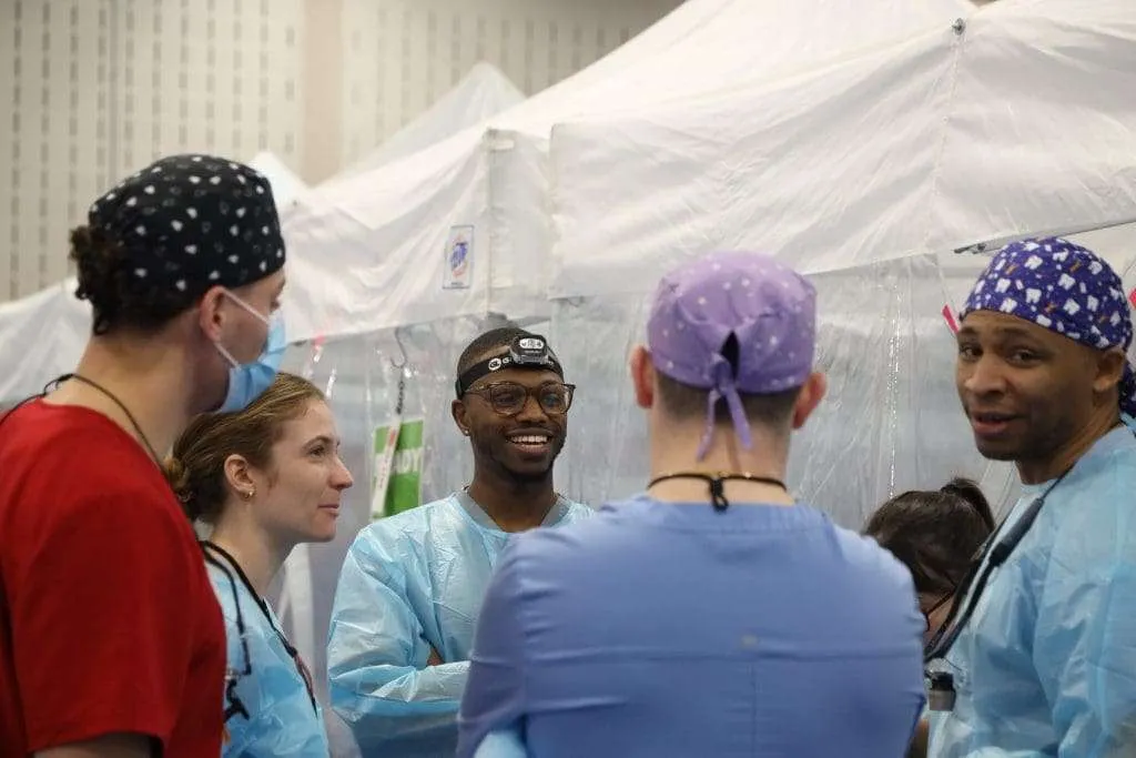 Dental students smiling at Remote Area Medical Clinic